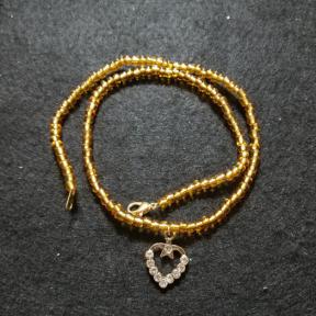 Gold Bead With Crystal Heart Necklace