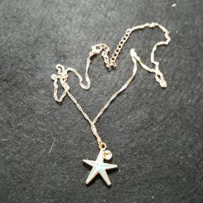 Turquoise Starfish on Gold Colored Necklace